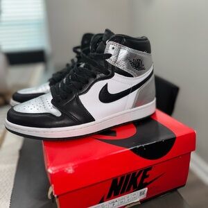 Nike Air Jordan 1 High in Black, White, and Silver